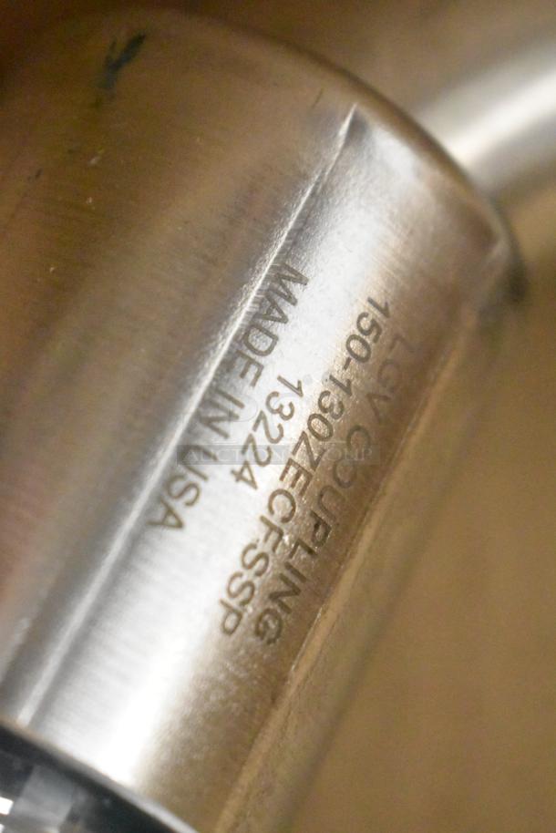 Engraving on stainless steel surface, reads "MADE IN USA" and includes model details. Part of Belshaw Adamatic TG-50.
