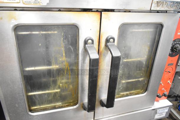 Vulcan commercial electric convection oven with view-through doors, thermostatic controls, and caster legs. Used condition.