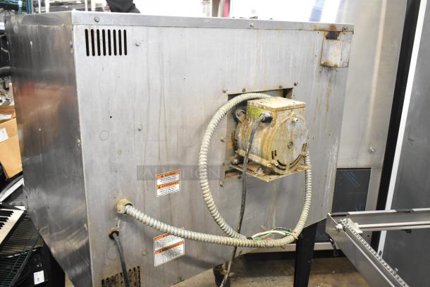 Vulcan commercial convection oven, electric, full size, with view-through doors, thermostatic controls, and caster legs.