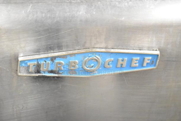 Turbochef HhC2020 logo on stainless steel, showing some wear.