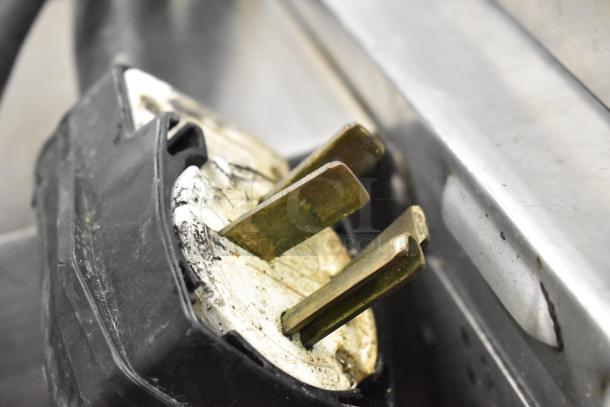 Close-up of a Turbochef HhC2020 oven power plug, showing wear. 208/240V, 3-phase connection.