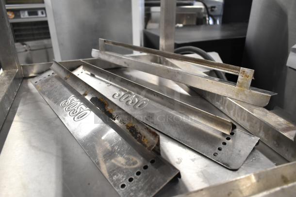 Metal components for a Turbochef HhC2020 oven on a stand, showing wear and rust, with visible "5050" markings.
