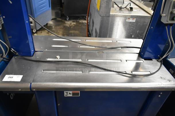 Polychem PC1000 automatic arch strapping machine, floor style, on casters. 115 volts, 1 phase, robust condition.