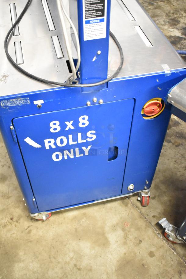 Polychem PC1000 strapping machine on casters, marked "8x8 ROLLS ONLY." 115V, 1 Phase, with control panel and wiring. Used condition.