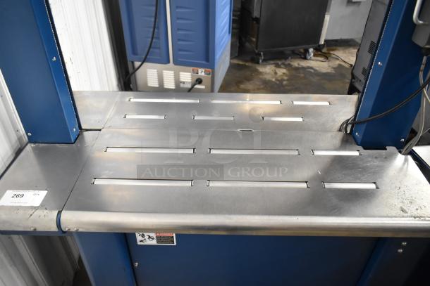 Polychem PC1000 automatic arch strapping machine on casters, commercial design, 115V, 1 phase. Visible condition: gently used.