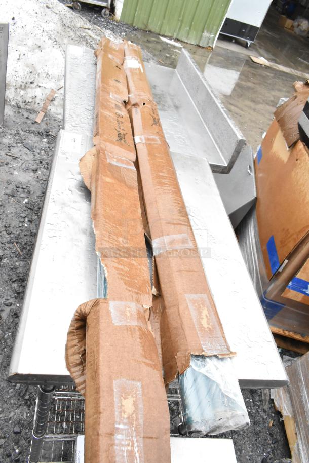 Two brand new Regency 460EGP74 NSF green epoxy posts in original packaging, partially visible, with minor box damage.