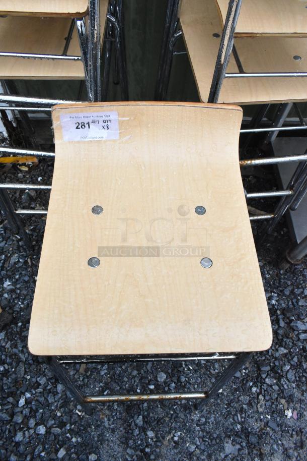 Set of 8 bar height stools with wood pattern seat and chrome legs. Good condition, label indicates quantity: 8.