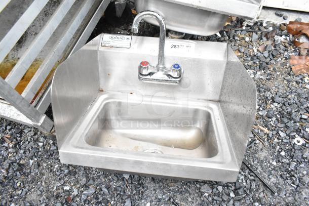 Krowne WM260 commercial single bay wall mount sink with faucet, handles, and side splash guards; stainless steel, used condition.