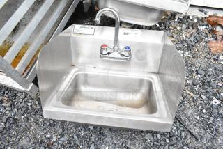 Krowne WM260 commercial single bay wall mount sink with faucet, handles, and side splash guards; stainless steel, used condition.