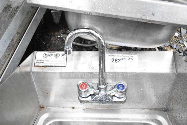 Krowne WM260 commercial wall mount sink with faucet, dual handles, and side splash guards. Made of stainless steel, visible labels.