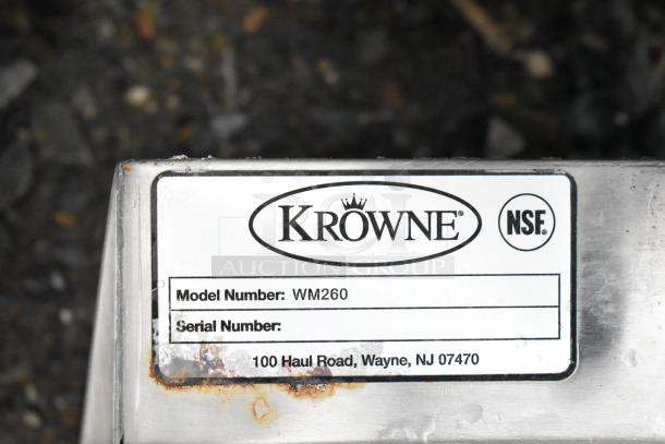 Krowne WM260 wall mount sink label, rust visible, NSF certified, model number displayed, located in Wayne, NJ.