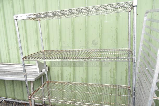 Chrome finish 4-tier wire shelving unit, moderate rust on shelves; buyer dismantles; consider freight for shipping.