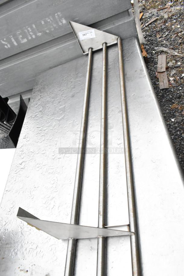 Metal tray slide with three rods, triangle support, and visible surface markings. Good condition.