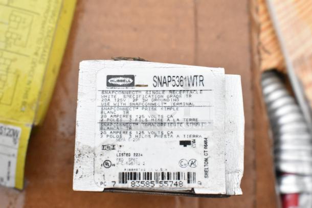 Hubbell SNAP5361WTR single receptacle, white, 20A 125V, NEMA 5-20R. Includes grounding details and specs on packaging.