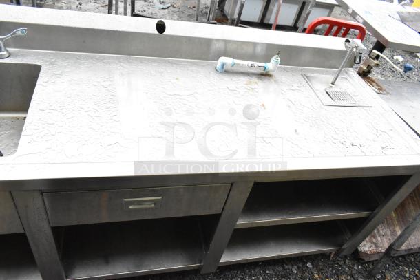 Commercial soda station with water dispenser, stainless sink basin, drawer, and under shelves in good condition.