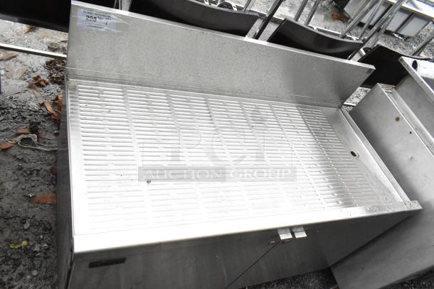 Perlick commercial drain board with doors and under shelf, stainless steel, used condition, visible surface wear.