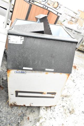 Ice-O-Matic commercial ice bin with rust and wear, visible brand label, used condition for auction.