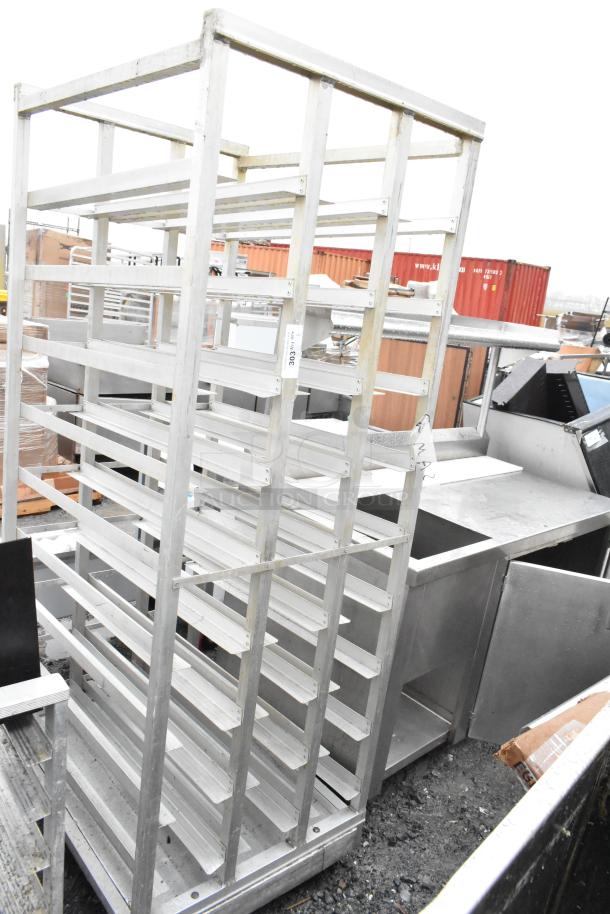 Commercial #10 Can Rack, metal structure, used condition, multiple shelves for storage, suitable for kitchen organization.