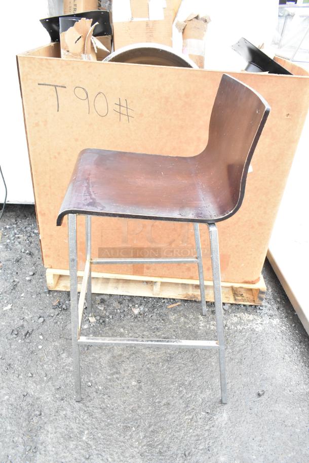 Bar height chair with wooden seat, metal legs, slight wear. Marked "T90#". 6 available in the auction.