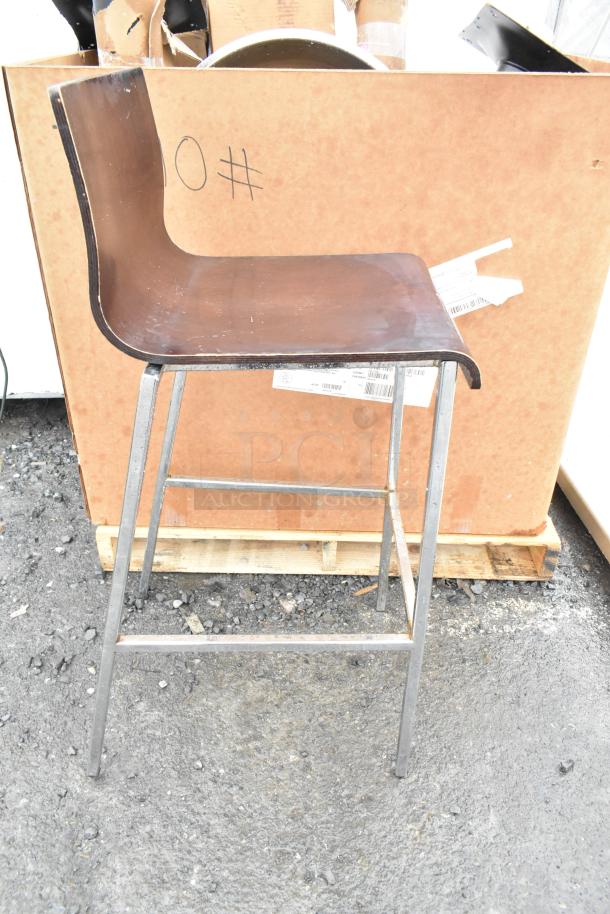 Bar height chair with curved wooden seat and metal legs. Slight wear on edges. Part of a set of six.