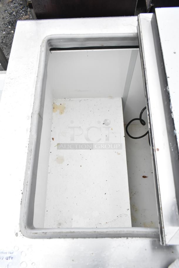 Excellence HFF-8-HC commercial chest freezer, 2 center hinge lids, 115 volts, visible wear, clean interior, model details shown.