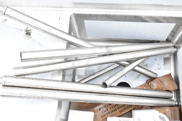 BRAND NEW SCRATCH AND DENT! Regency 600S32323224 commercial 3 bay sink with dual drain boards. Stainless steel pipes shown.