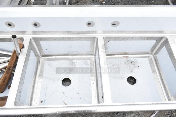 Brand new Regency 600S32323224 commercial 3-bay sink with dual drain boards, scratch and dent condition.