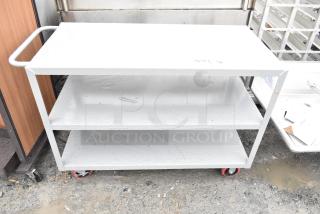 Lavex 48" x 24" x 35" steel utility cart, three shelves, fully welded, scratch and dent condition, red caster wheels.