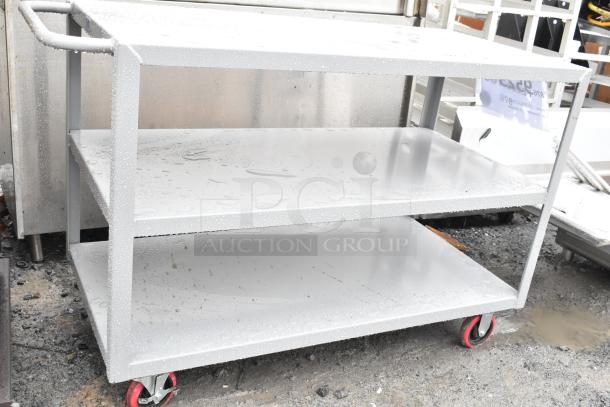 Brand new Lavex steel utility cart, 48"x24"x35", three shelves, scratch and dent, fully welded, red casters.