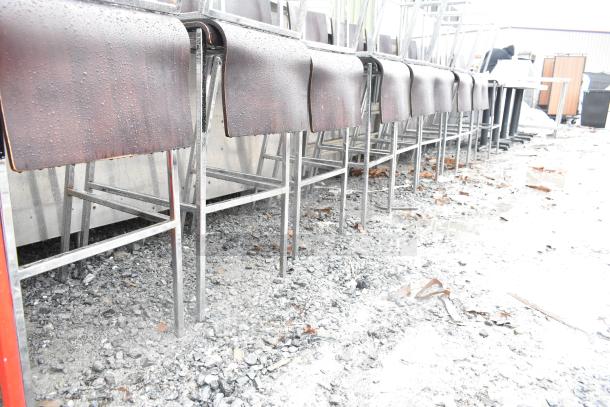 Bar height chairs with wooden seats, chrome frames, damp condition. Auction for 19 chairs.