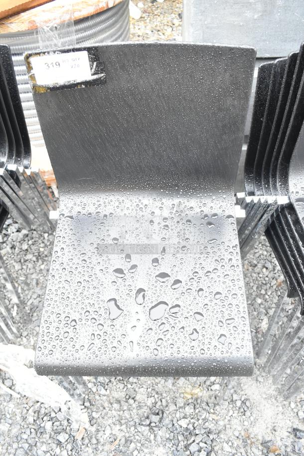 20 dining height chairs with black seats and chrome finish frames, stackable design, in good condition, water on seats.