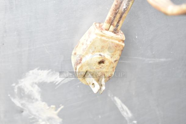 Corroded electrical plug with visible rust, indicating need for maintenance or replacement; part of Turbo Air cooler.