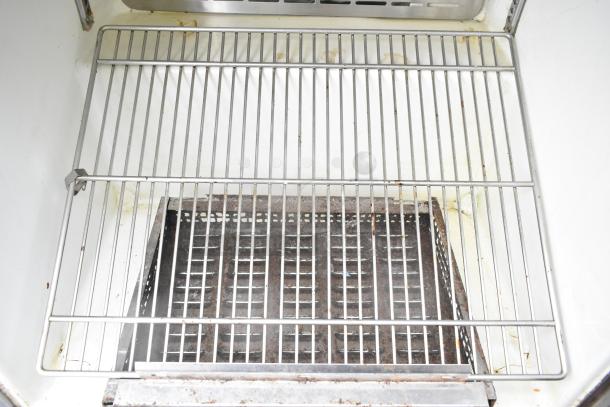 Turbo Air TUR-28SD internal view; wire shelf, clean interior, good condition, commercial cooler model TUR-28SD, 115V.