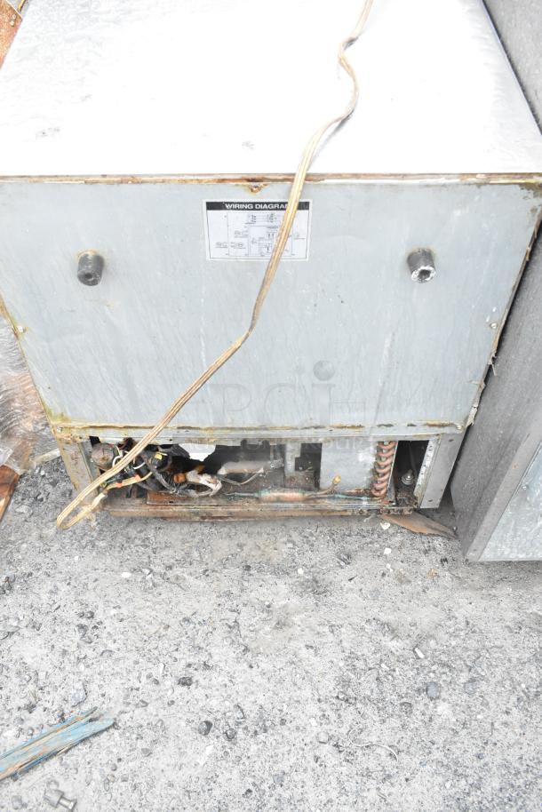 Turbo Air TUR-28SD undercounter cooler, condition shows wear, wiring visible. Model label on the back panel.