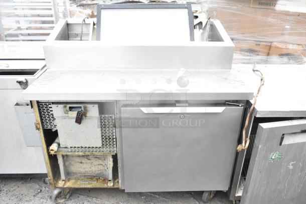 2017 Traulsen TS048HT commercial pizza prep table on casters, 115V, 1 phase, visible wear, stainless steel finish.