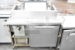 2017 Traulsen TS048HT commercial pizza prep table on casters, 115V, 1 phase, visible wear, stainless steel finish.