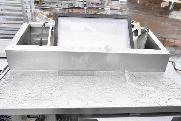 2017 Traulsen TS048HT Commercial Pizza Prep Table with stainless steel construction and commercial casters. 115 volts, 1 phase.