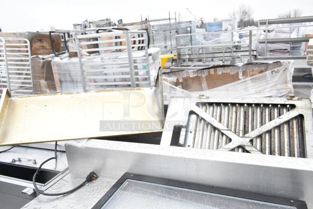 2017 Traulsen TS048HT commercial pizza prep table with casters, visible wear, includes components, 115V, 1 phase.