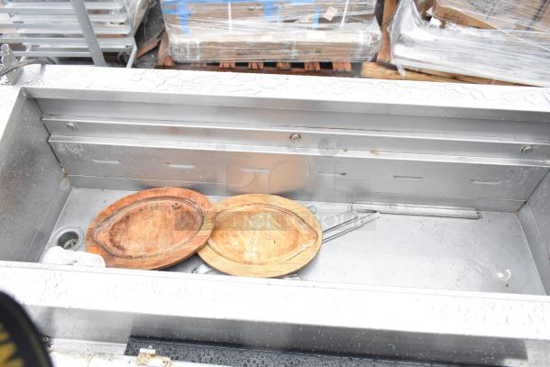 2017 Traulsen TS048HT commercial pizza prep table on casters, stainless steel, 115 volts, 1 phase, includes two wooden boards.