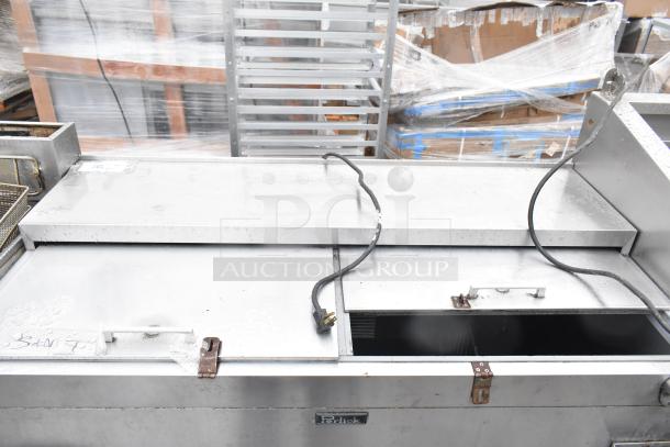 Perlick 7260E-SIL-UL back bar cooler with 2 sliding lids on casters. Signs of wear, 115V, 1 phase. Visible power cords.