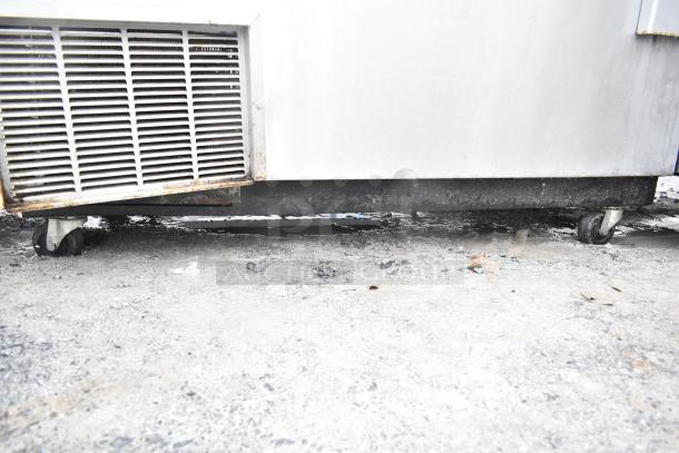 Perlick 7260E-SIL-UL commercial back bar cooler with sliding lids, visible casters. 115 volts, 1 phase, in used condition.