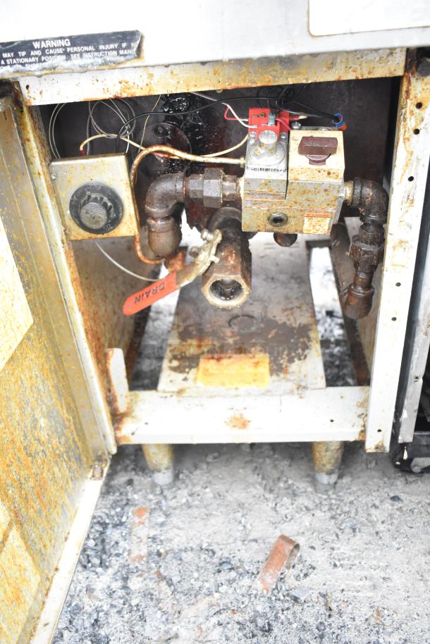 Frymaster GF14SD deep fat fryer, natural gas, 105,000 BTU, rust present, labels indicate drain and warning.