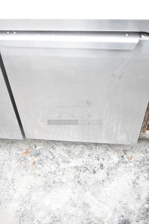 Continental CRA68 3-door undercounter cooler, stainless steel, commercial, 115 volts, 1 phase, shows wear.