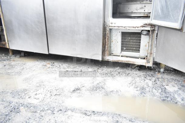 Continental CRA68 3 Door Undercounter Cooler, worn condition, rust visible. 115 volts, 1 phase, commercial use.