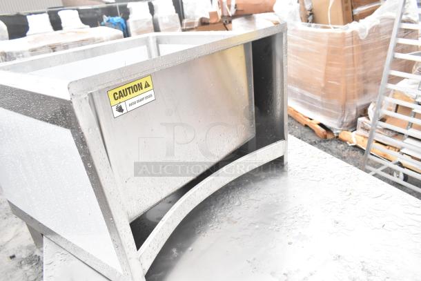 Regency stainless steel mop sink, 25" 16-gauge, new scratch and dent, 20"x16"x12" bowl, caution label on edge.