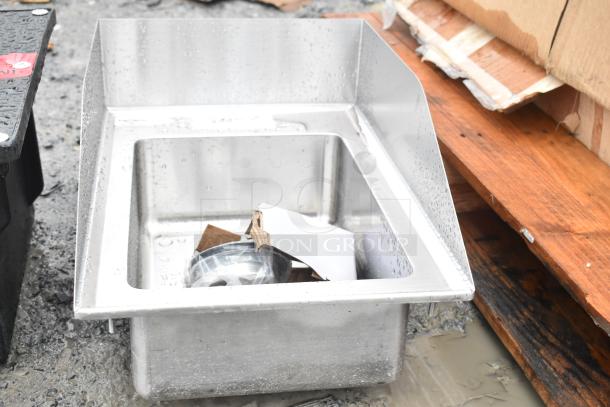 Brand new Regency 600DI110145S 10"x14"x5" drop-in sink, 16-gauge stainless steel, minor scratches, side splashes shown.