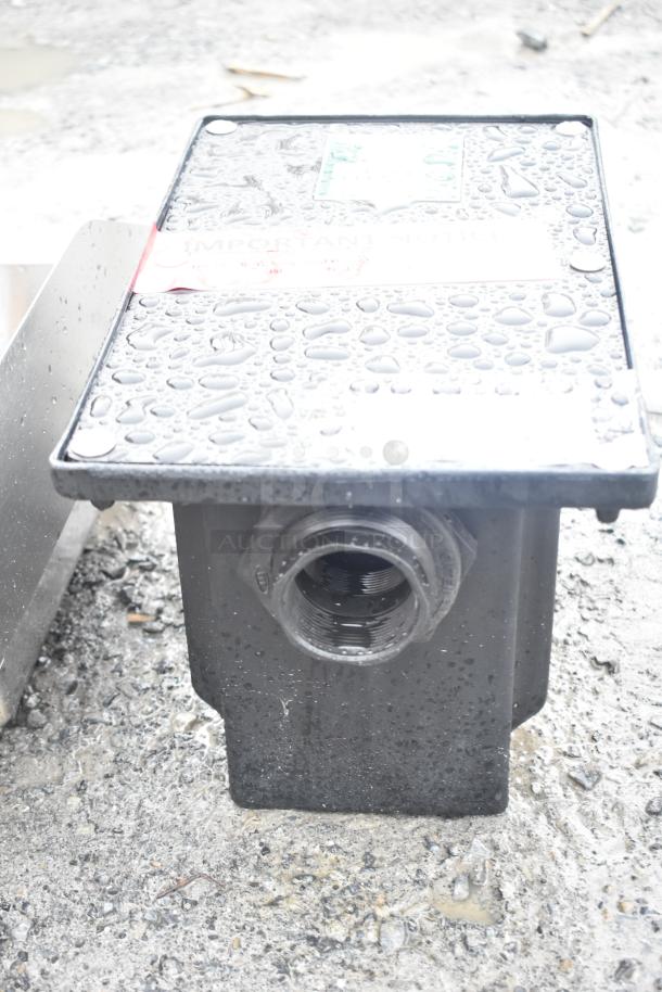 Brand new Ashland PolyTrap 4804 grease trap, 8 lb capacity, with threaded connections. Surface has light scratches.
