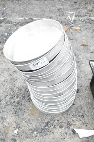 Stack of 17 HA5014 round baking pans, new, metal, auction label reads "330" and "x17".