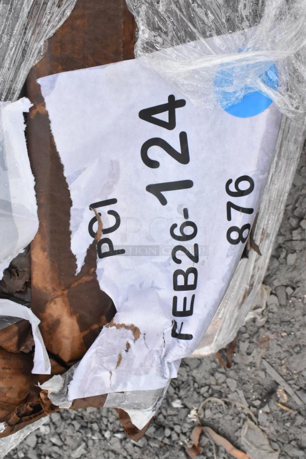 Damaged box containing 5 scratch and dent items, including a utility cart and chair. Visible label FEB26-124 indicates auction lot.