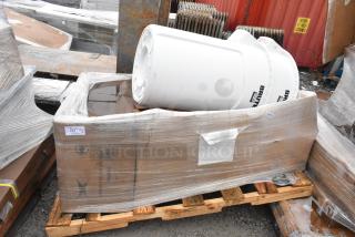 4 new items on pallet: pump motor, sink, mop sink. Visible white Brute container. Wrapped in plastic, marked FEB26-94.